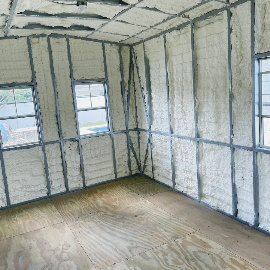 Closed-cell spray foam insulation applied to wall cavities in a residential project in White Lake
